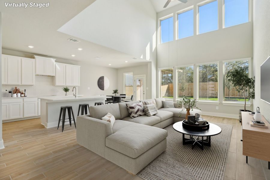 Virtually staged living room in the Cedar floorplan at a Meritage Homes community.