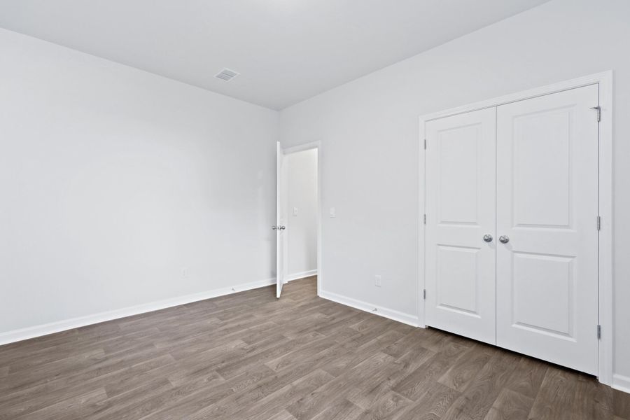 Spacious, unfurnished interior of a new home in Pine Hills at Cane Bay, Summerville (Image 27).