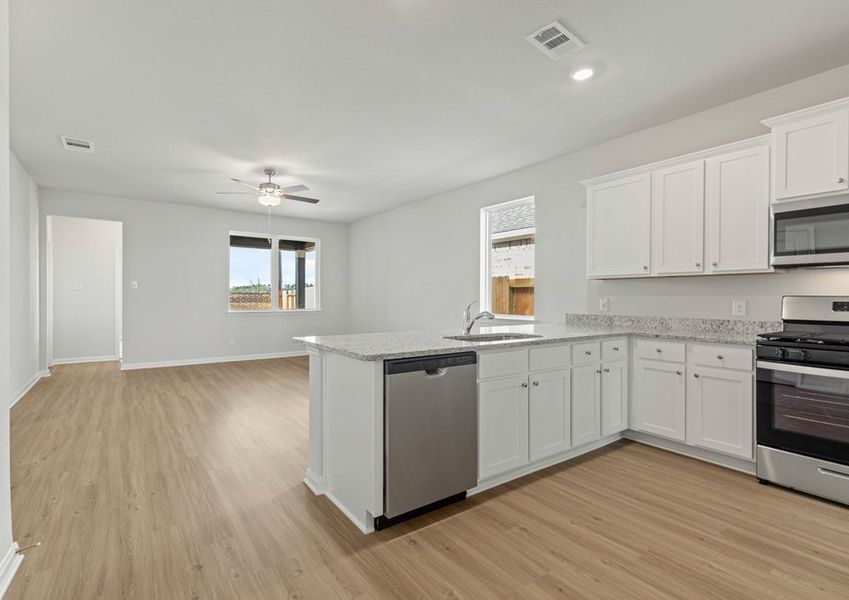 Chef-ready kitchen and adjoining family room Chef-ready kitchen and adjoining family room