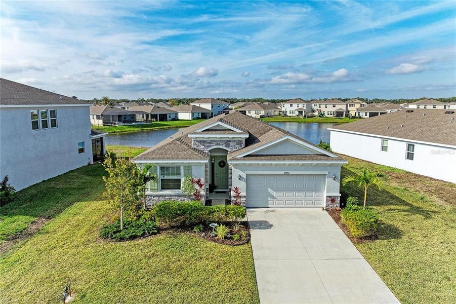Front exterior of a new home in Coddington, Bradenton, FL, highlighting curb appeal (Image 23). Front exterior of a new home in Coddington, Bradenton, FL, highlighting curb appeal (Image 23).