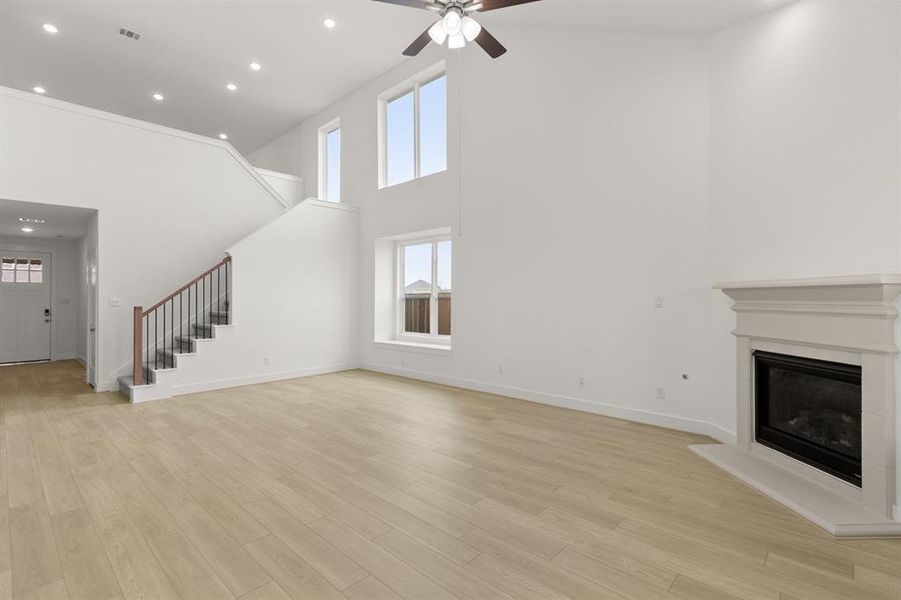 Expansive windows that invite natural light to dance through spacious living areas, creating a welcoming atmosphere perfect for gatherings or quiet moments of reflection.