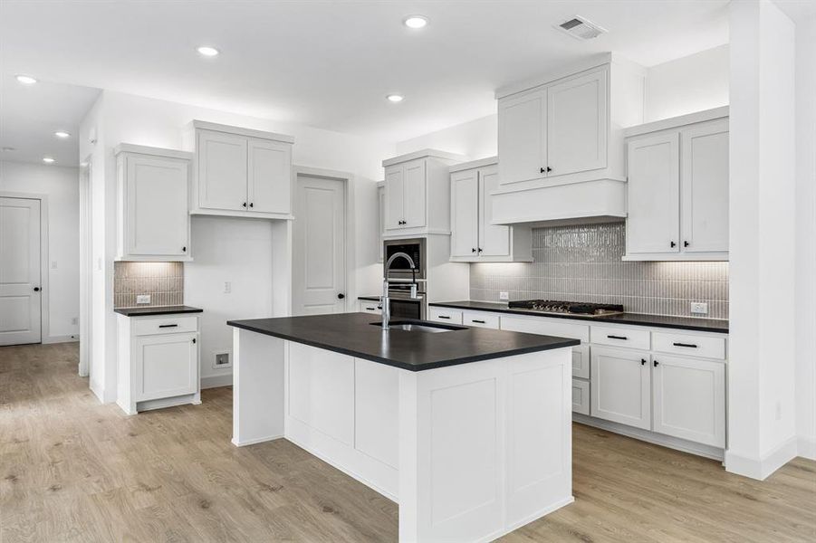 No shortage of style or space in this chef's dream kitchen!