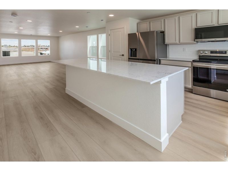 Furnished interior view inside a new home in Bloom Trailblazer Collection - Single Family Homes, Fort Collins (Image 11). Furnished interior view inside a new home in Bloom Trailblazer Collection - Single Family Homes, Fort Collins (Image 11).