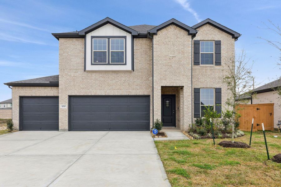 Front exterior of a new home in River Ranch, Dayton, TX, highlighting curb appeal (Image 1). Front exterior of a new home in River Ranch, Dayton, TX, highlighting curb appeal (Image 1).