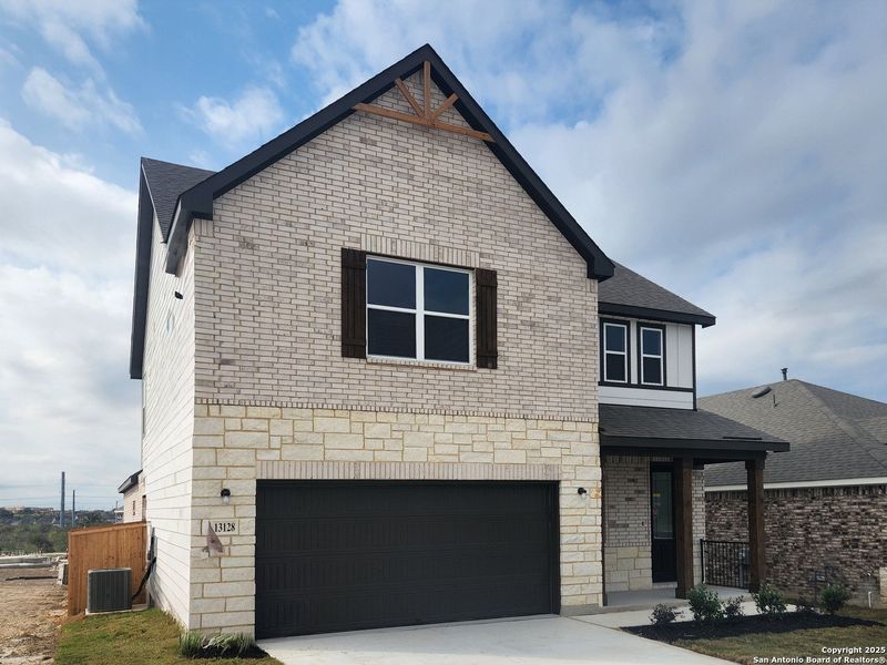 Front exterior of a new home in Arcadia Ridge, San Antonio, TX, highlighting curb appeal (Image 1).