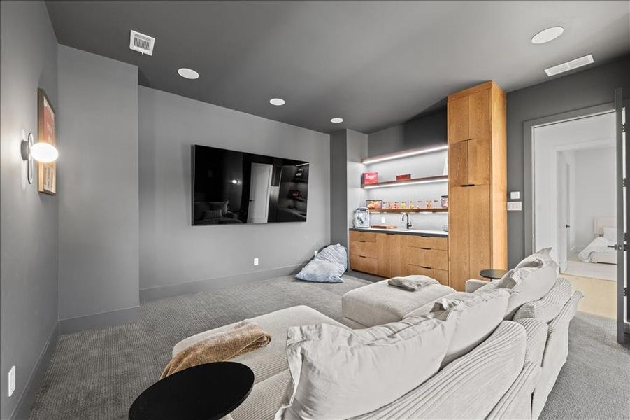 Room featuring light carpet and recessed lighting