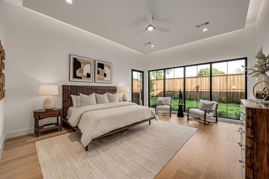 Bedroom featuring light wood-style flooring, recessed lighting, and ceiling fan Bedroom featuring light wood-style flooring, recessed lighting, and ceiling fan