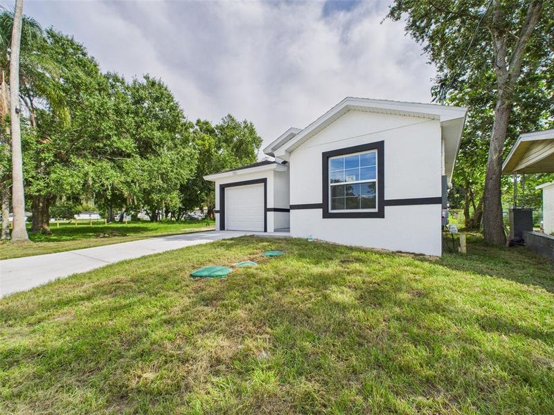 Front exterior of a new home in , Lakeland, FL, highlighting curb appeal (Image 27).