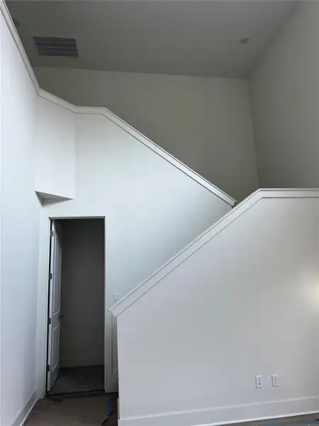 Stairway featuring baseboards Stairway featuring baseboards