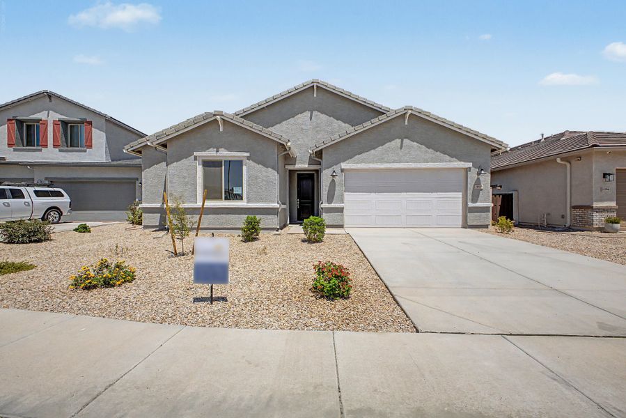 Front exterior of a new home in Wildera, San Tan Valley, AZ, highlighting curb appeal (Image 1). Front exterior of a new home in Wildera, San Tan Valley, AZ, highlighting curb appeal (Image 1).