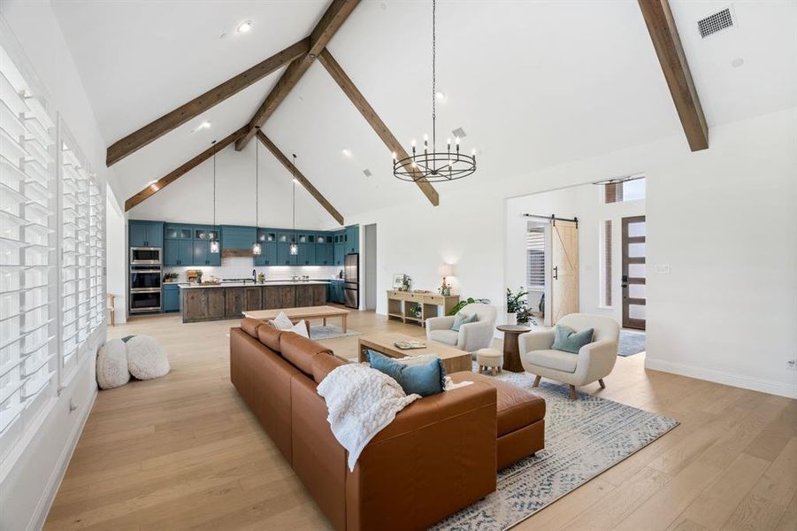 Farmhouse charm meets architectural detail with striking cedar-wrapped beams and vaulted ceilings.