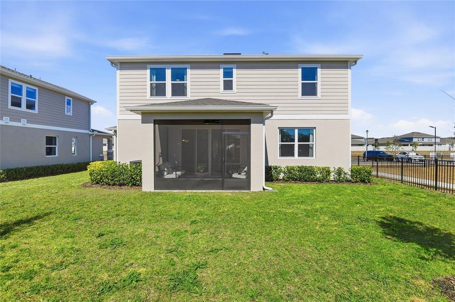 Exterior details and patio area of a home in Seaport Village, Tavares (Image 2).