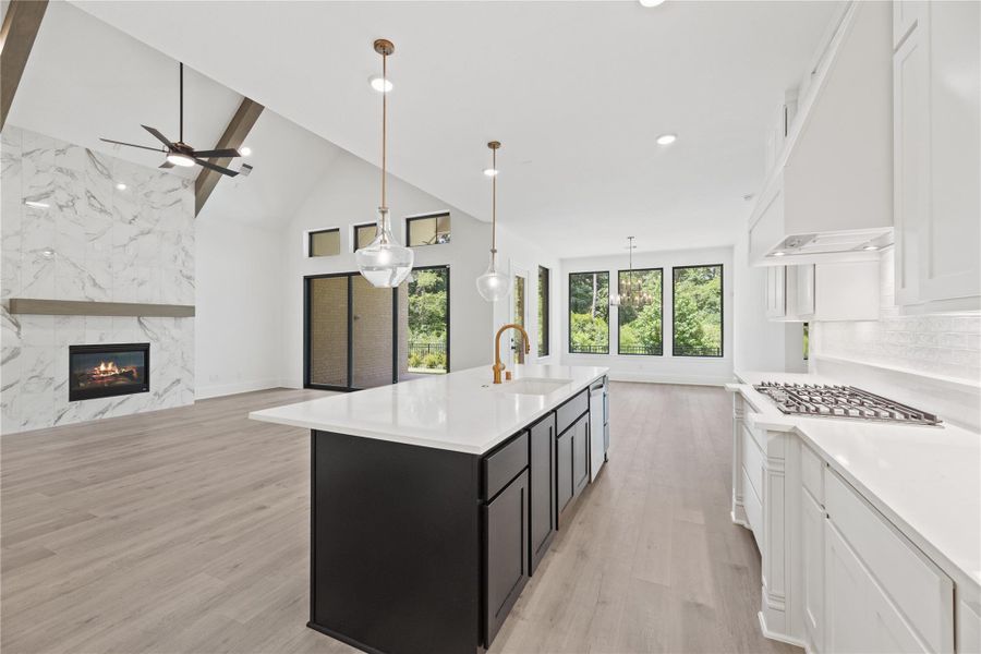 Stainless steel appliances and gold features are beautiful accents to this gourmet kitchen.