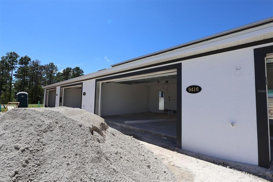 Exterior details and patio area of a home in Tribute at Ovation, Winter Garden (Image 23). Exterior details and patio area of a home in Tribute at Ovation, Winter Garden (Image 23).