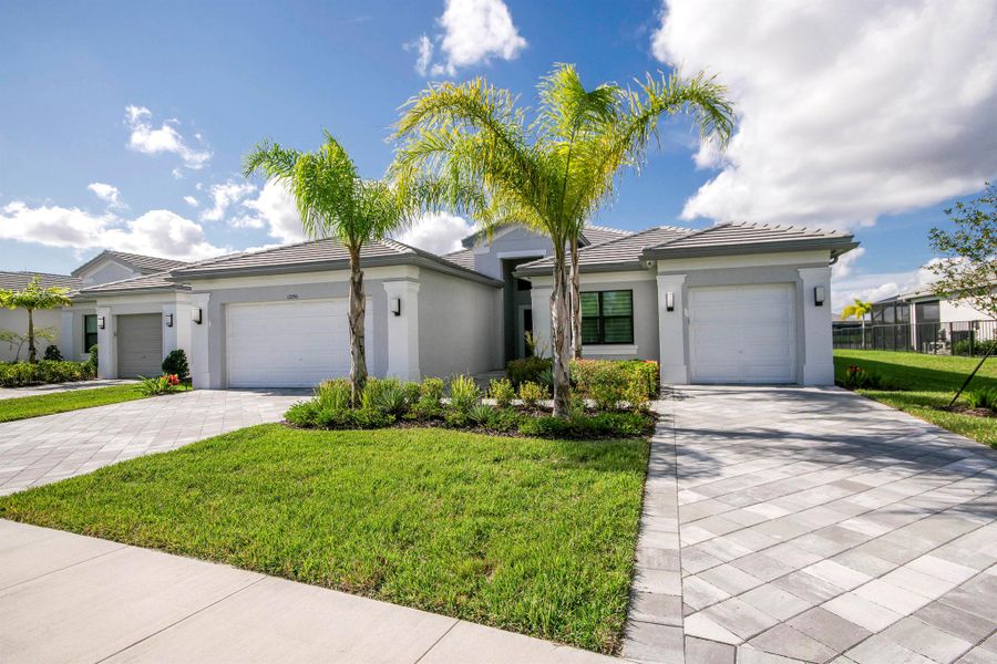 Front exterior of a new home in , Port St. Lucie, FL, highlighting curb appeal (Image 24).