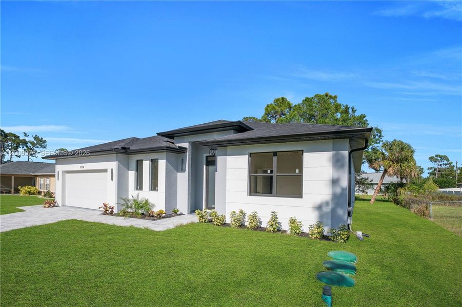 Front exterior of a new home in , North Port, FL, highlighting curb appeal (Image 19).