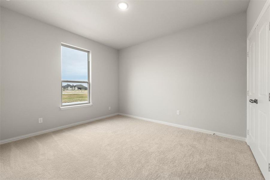 Spare room with light carpet and recessed lighting Spare room with light carpet and recessed lighting