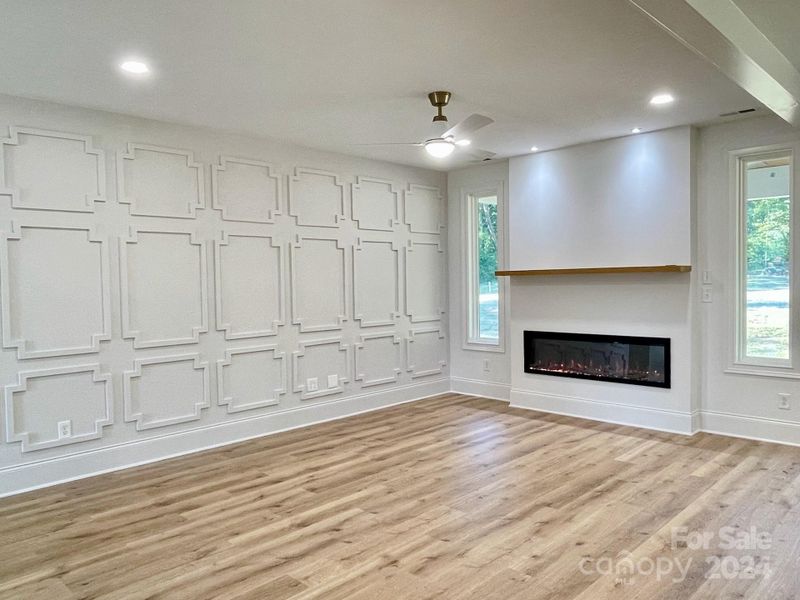 Great room with wainscoting.