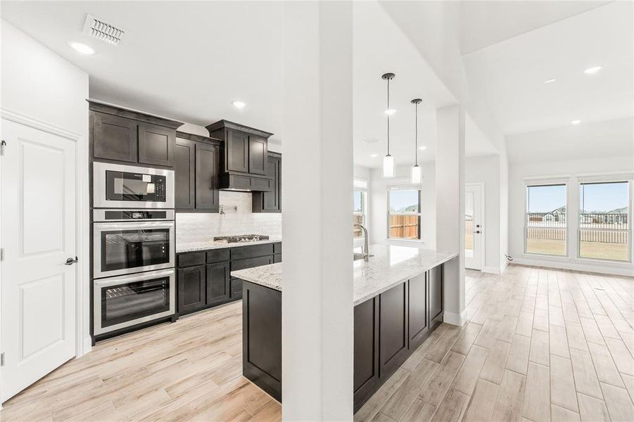 Furnished interior view inside a new home in Stone River Glen 60s, Royse City (Image 11).