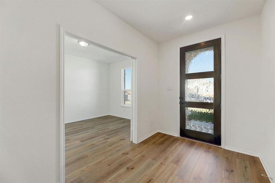 Home office (flex space) near the front entrance, offering a quiet and productive workspace with a welcoming view overlooking the front of the house.