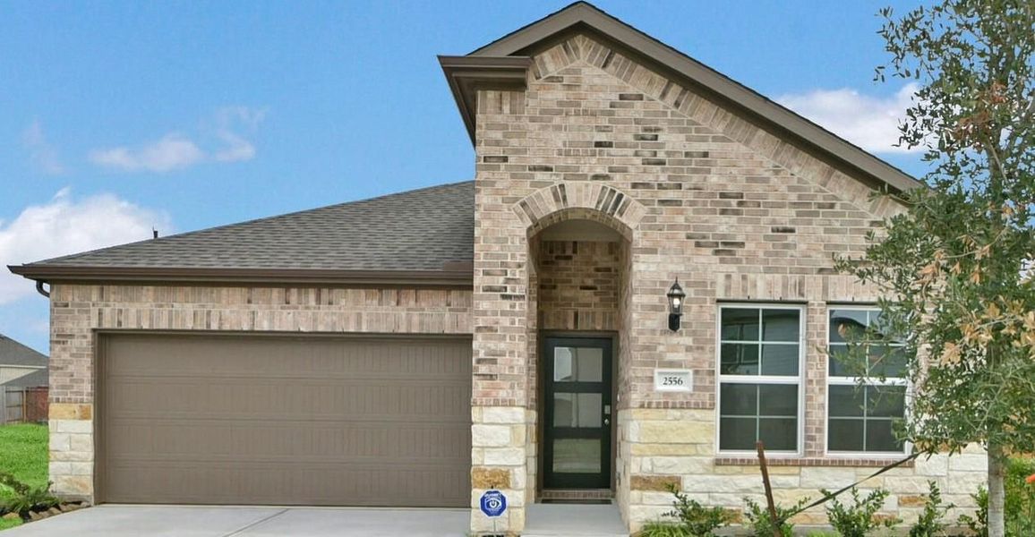 Front exterior of a new home in Sunterra, Katy, TX, highlighting curb appeal (Image 106). Front exterior of a new home in Sunterra, Katy, TX, highlighting curb appeal (Image 106).