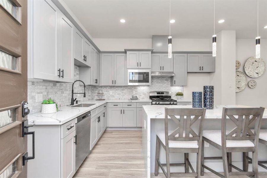 Kitchen and island right when you step in from the front door.