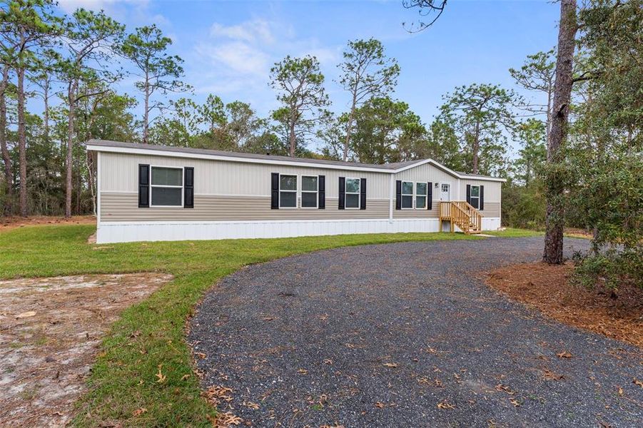 Exterior details and patio area of a home in , Brooksville (Image 2). Exterior details and patio area of a home in , Brooksville (Image 2).