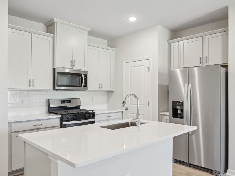 Furnished interior view inside a new home in Cadence Meadows Townes, Zebulon (Image 6). Furnished interior view inside a new home in Cadence Meadows Townes, Zebulon (Image 6).