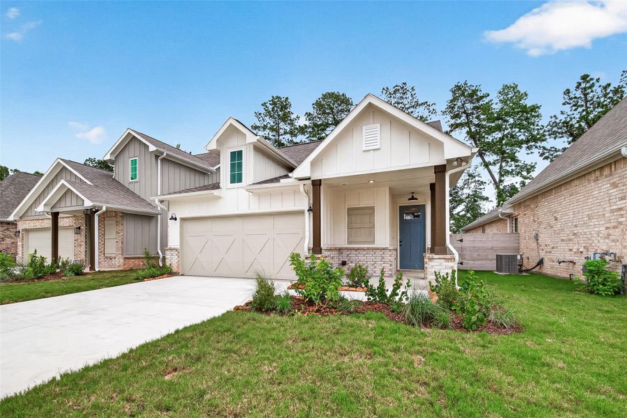 Front exterior of a new home in Two Step Farm, Montgomery, TX, highlighting curb appeal (Image 2). Front exterior of a new home in Two Step Farm, Montgomery, TX, highlighting curb appeal (Image 2).