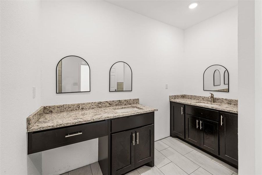 Bathroom featuring vanity and tile patterned flooring