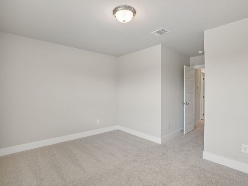 Secondary Bedroom in the Medina floorplan at a Meritage Homes community. Secondary Bedroom in the Medina floorplan at a Meritage Homes community.