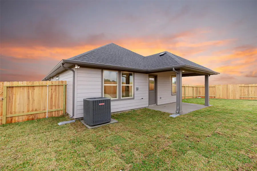 Exterior details and patio area of a home in Montgomery Ridge: Landmark Collection, Montgomery (Image 2).