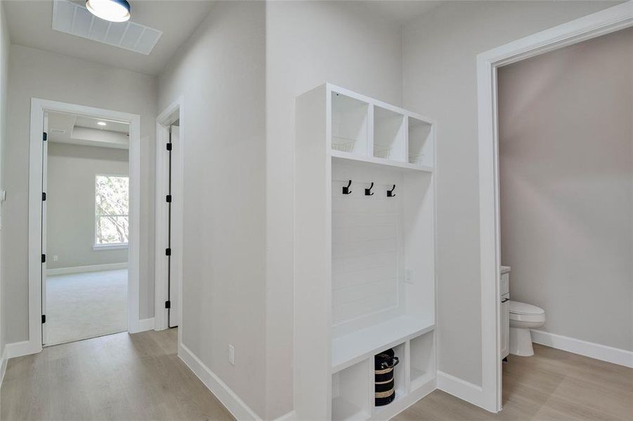 Mudroom with baseboards and light wood finished floors Mudroom with baseboards and light wood finished floors