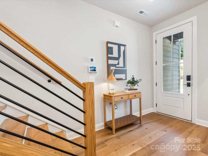 First floor oak box stairs and open rail. *Model Photos | Actual finishes, structural selections, and orientation may vary. First floor oak box stairs and open rail. *Model Photos | Actual finishes, structural selections, and orientation may vary.