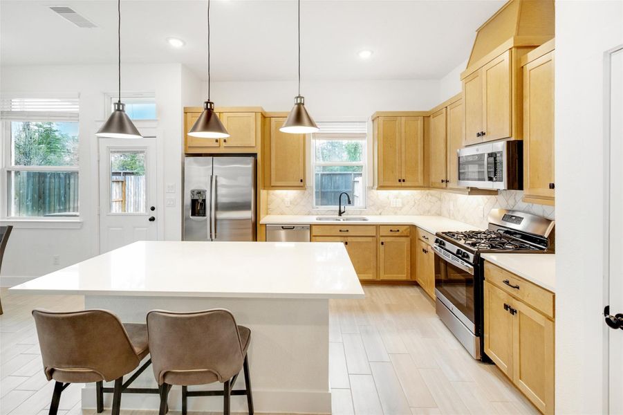Gorgeous!! Your kitchen offers tons of storage and plenty of counter space, plus stainless appliances. Gorgeous!! Your kitchen offers tons of storage and plenty of counter space, plus stainless appliances.