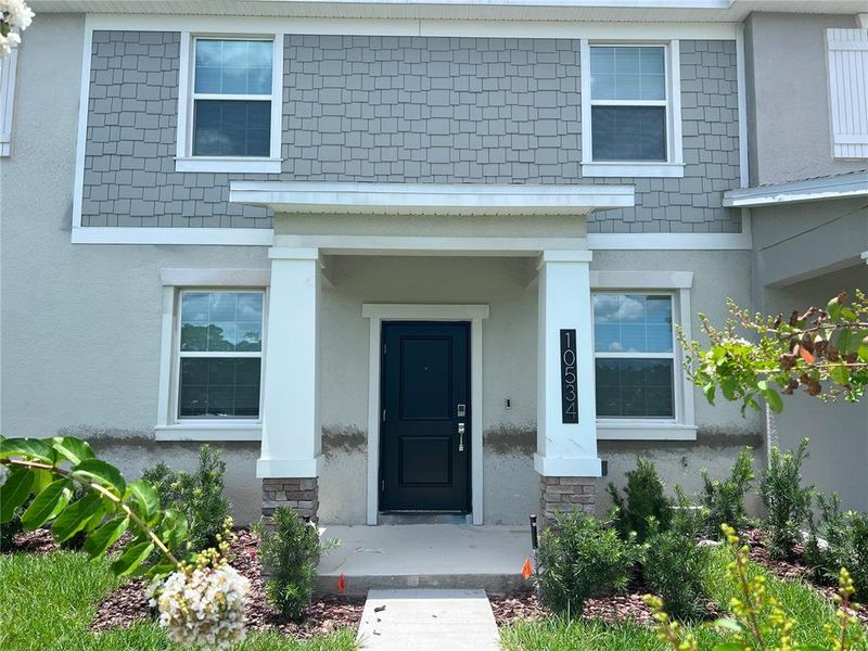 Front exterior of a new home in , Winter Garden, FL, highlighting curb appeal (Image 2). Front exterior of a new home in , Winter Garden, FL, highlighting curb appeal (Image 2).