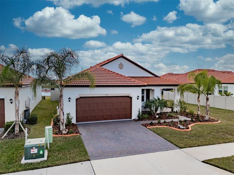 Front exterior of a new home in , Wimauma, FL, highlighting curb appeal (Image 22).