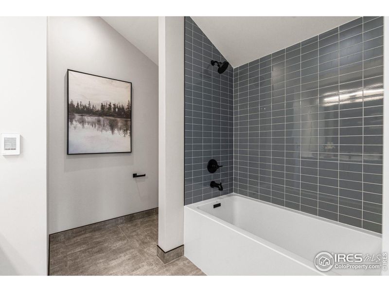 Upper level en-suite + heated tile floors