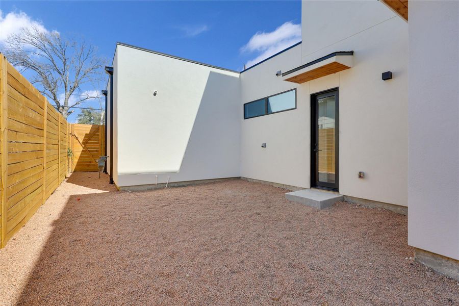 Side view of property featuring stucco siding