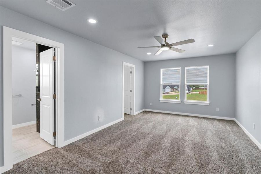 Unfurnished room with carpet floors, a ceiling fan, and recessed lighting