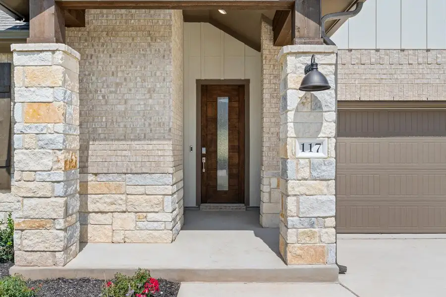 Exterior details and patio area of a home in Lariat, Liberty Hill (Image 3).