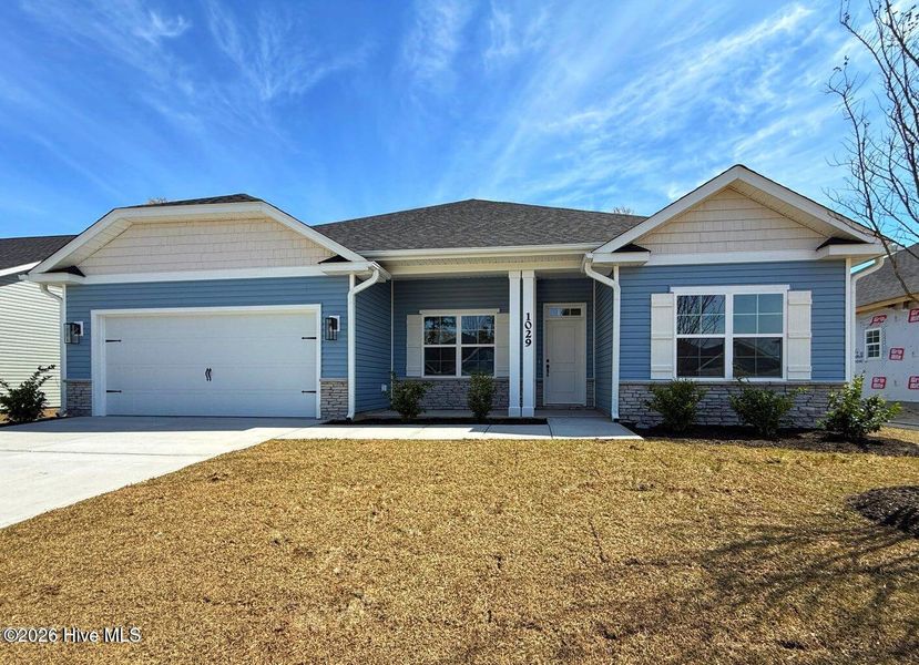 Front exterior of a new home in East Lake, Leland, NC, highlighting curb appeal (Image 1). Front exterior of a new home in East Lake, Leland, NC, highlighting curb appeal (Image 1).