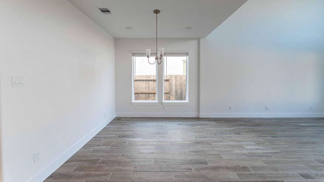 Spacious, unfurnished interior of a new home in Sunterra, Katy (Image 18).