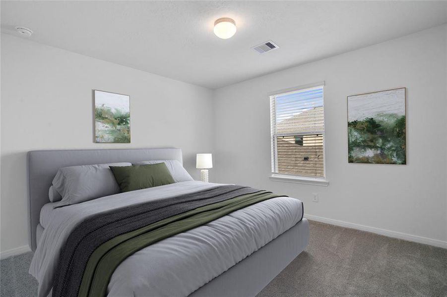 Secondary bedroom features plush carpet, neutral paint, lighting, large window with privacy blinds and ample sized closet space.