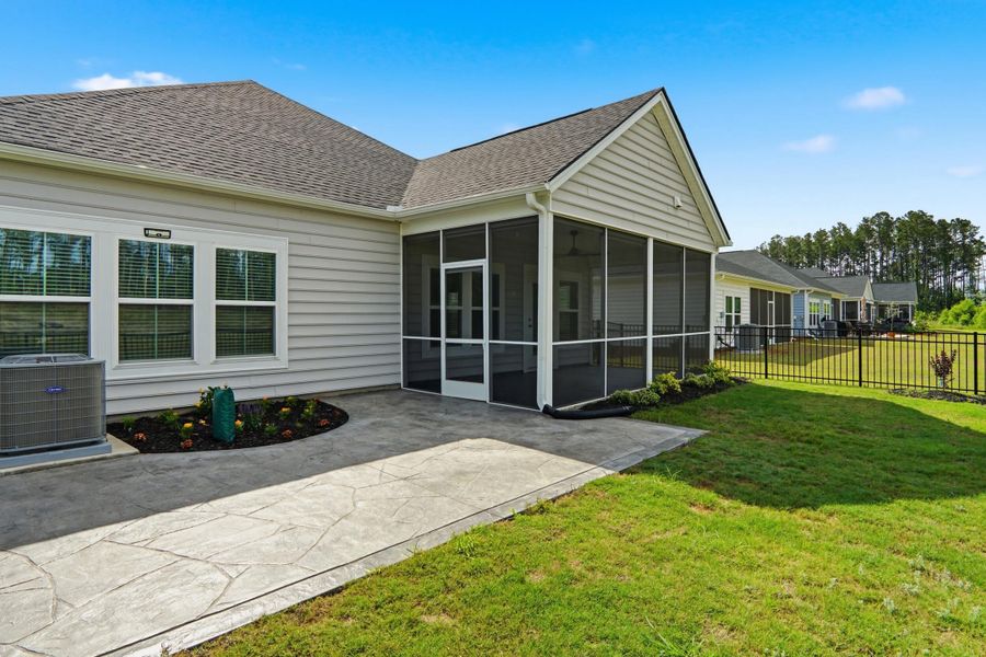 Exterior details and patio area of a home in Horizons at Summers Corner | 55+, Summerville (Image 38).