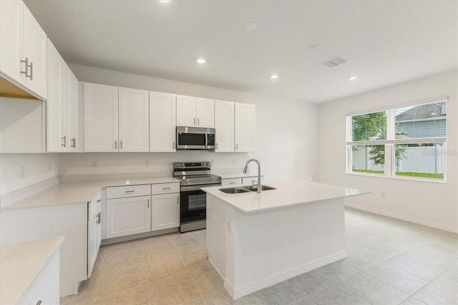 Furnished interior view inside a new home in Mirror Lake Village, Fruitland Park (Image 3).