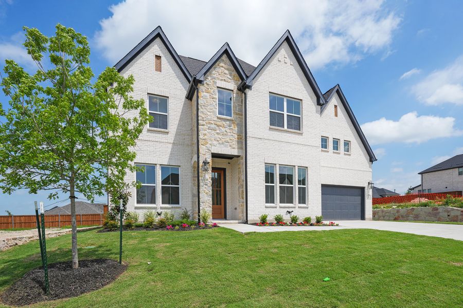 Front exterior of a new home in Hillside Village, Celina, TX, highlighting curb appeal (Image 1). Front exterior of a new home in Hillside Village, Celina, TX, highlighting curb appeal (Image 1).