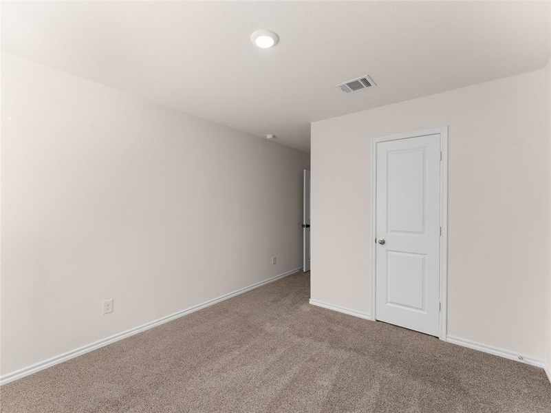 Empty room featuring carpet floors