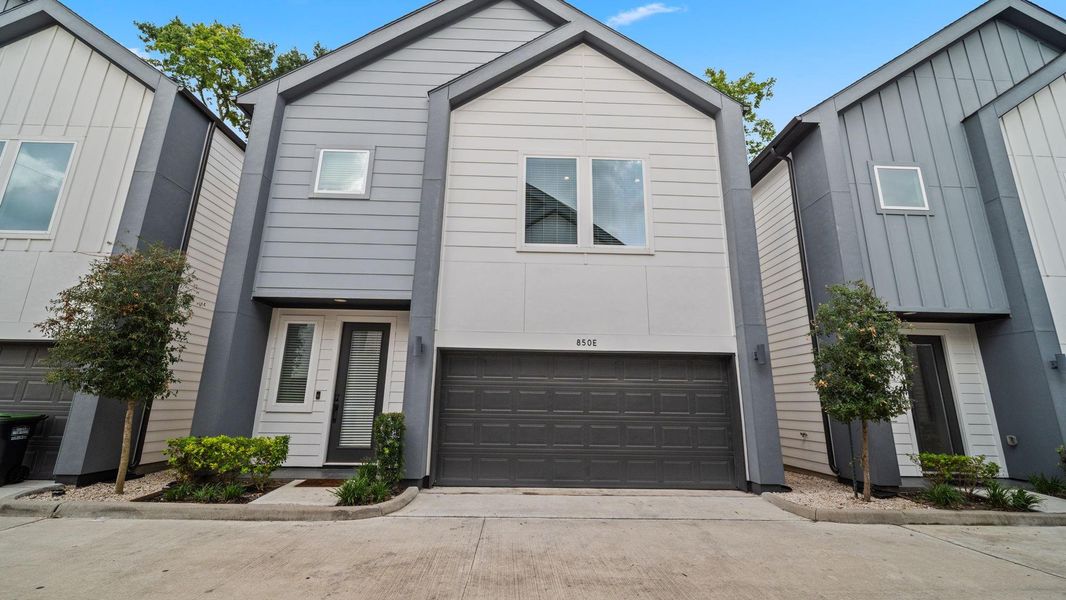 Front exterior of a new home in Highland Heights, Houston, TX, highlighting curb appeal (Image 21).