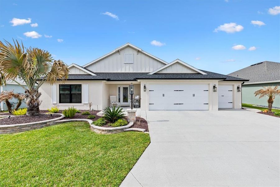 Front exterior of a new home in , The Villages, FL, highlighting curb appeal (Image 23).